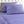 Shavel purple sheet set with a tonal paisley pattern on a tufted white headboard