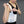 ThermApparel cooling vest being adjusted by a person wearing a black top