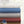 Stack of four Shavel heated blankets in white blue grey and red with a digital controller