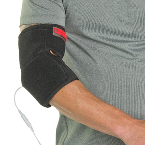 Person wearing a black electric elbow brace with a power cord