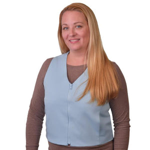 Woman wearing a light blue Polar Products cooling vest over a brown long sleeve shirt