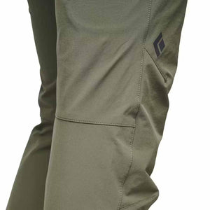 Close up of olive green Black Diamond technical pants showing knee stitching and logo