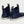 Rear view of navy blue Huk ankle boots with white soles and pull tabs