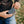 Person connecting a power bank to an ActionHeat heated jacket