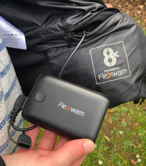 8K Flexwarm power bank connected to a black garment