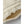 Close up of cream colored wool fabric with visible stitching and textured edge