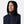 Man wearing a navy Helly Hansen hooded jacket with red zipper pulls