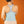 Person wearing a light blue Opal back support wrap over a grey racerback tank top