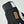Close up of black and white Hestra glove with leather brand patch