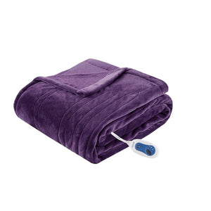 Folded purple electric throw blanket with a white remote control