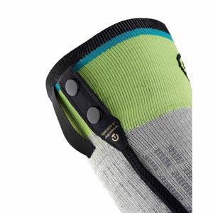 Close up of a green and grey heated sock cuff with two black snap buttons and a power icon