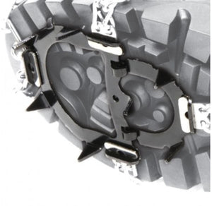 Hillsound traction spikes attached to the sole of a hiking boot