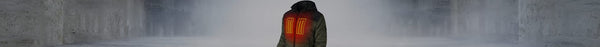 A person wears a dark green hooded jacket, viewed from behind, featuring three glowing orange vertical heating panels on the back, against a blurred gray concrete background.