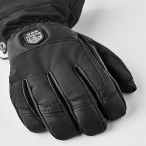 Black Hestra winter glove with leather palm and Hestra brand logo patch