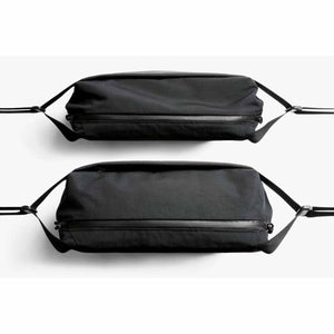 Two black Bellroy sling bags shown from a top down perspective