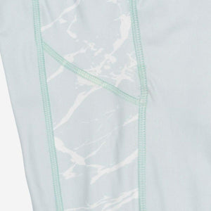 Light blue leggings with white marble print side panel detail