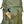 Kelty backpack front pocket containing a Field Notes notebook and sunglasses