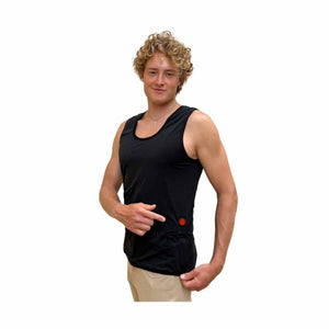 Man wearing a black Glovii heated tank top pointing to the red power button on the side
