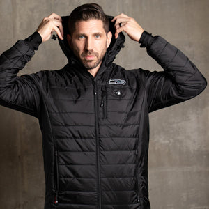 Man wearing a black ActionHeat Seattle Seahawks heated jacket with hood up