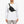 Person wearing a black Bellroy sling bag across the chest