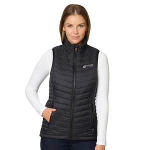 Woman wearing a black Venture Heat quilted vest over a white long sleeve shirt