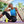 Woman wearing an AlphaCool cooling vest while sitting on a yoga mat outdoors