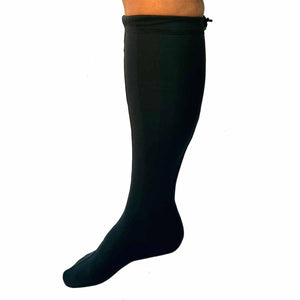 Black compression sock worn on a lower leg