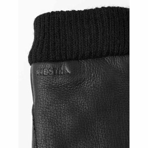 Black leather Hestra glove with ribbed knit cuff