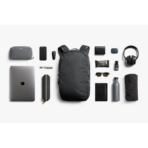 Bellroy backpack surrounded by organized daily carry items including laptop, headphones, and accessories