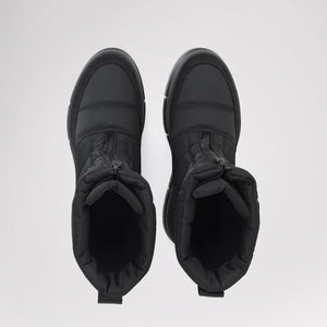 Pair of black quilted ankle boots with front zipper closure viewed from above