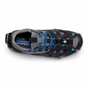 Black Diamond traction device fitted over a grey trail running shoe
