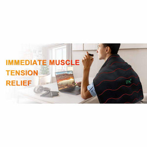 Person wearing a black UTK Technology heating pad over their shoulders while working at a laptop