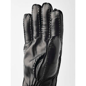 Black leather glove with visible exterior stitching