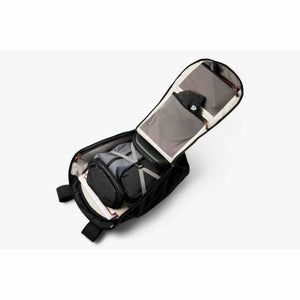 Open black backpack with internal packing cubes and organized compartments