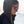Person wearing Smith sunglasses and a dark hooded jacket