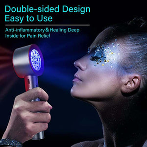 Handheld double sided red and blue light therapy device held near a person face