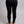 Back view of Merino Skins black thermal leggings on a person