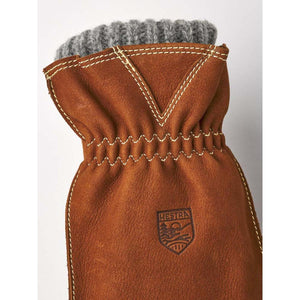 Brown leather Hestra glove with grey wool cuff and decorative stitching