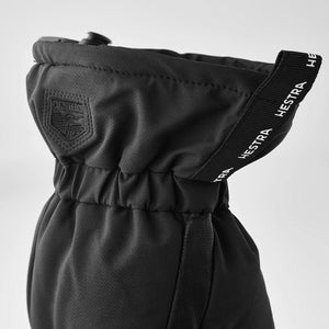 Black Hestra glove cuff with elasticated wrist and branded pull tab