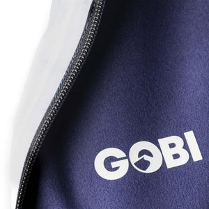 Close up of Gobi Heat logo on navy blue fabric with zipper detail