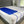 Mattress Cooler blue cooling pad secured on top of a white mattress