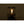 Lit glass camping lantern with metal frame