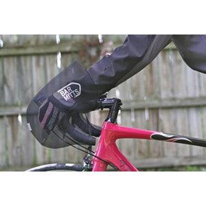Cyclist hand inside a black Bar Mitts handlebar cover on a pink road bike