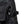 Close up of black work trousers featuring a zippered pocket and an adjustable side strap