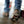 Person wearing ice cleats on boots walking on icy surface