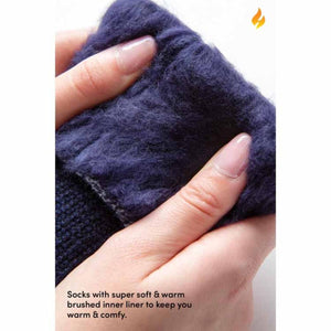 Close up of hands holding a navy blue sock with a thick brushed fleece lining