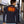 Man wearing a black long sleeve shirt with a glowing orange heating element graphic on the back