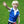 Young boy wearing a blue compression vest over a white polo shirt and star patterned shorts