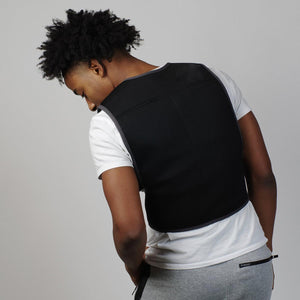 Person wearing a black Oro Sports mesh vest over a white t-shirt