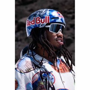 Person wearing a blue camouflage Smith Optics helmet and white sunglasses